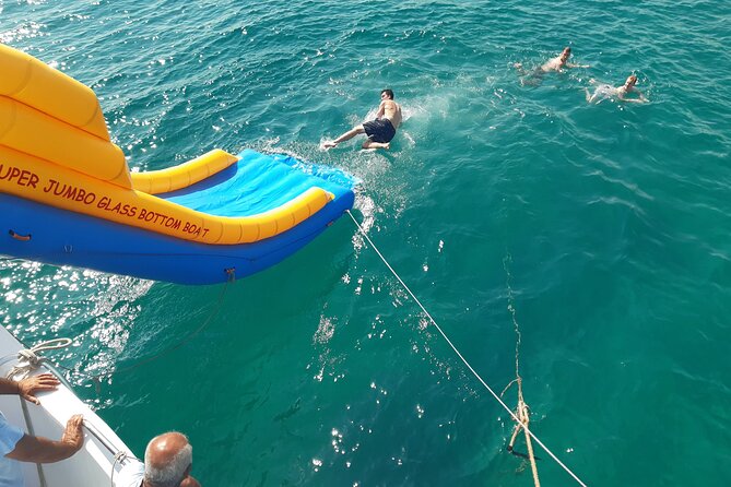 2.5 hour Glass Bottom Boat Trip, Snorkeling, Sliding and Fun - Stop 3: swimming, snorkeling, competitions, and the Super Jumbo Slide