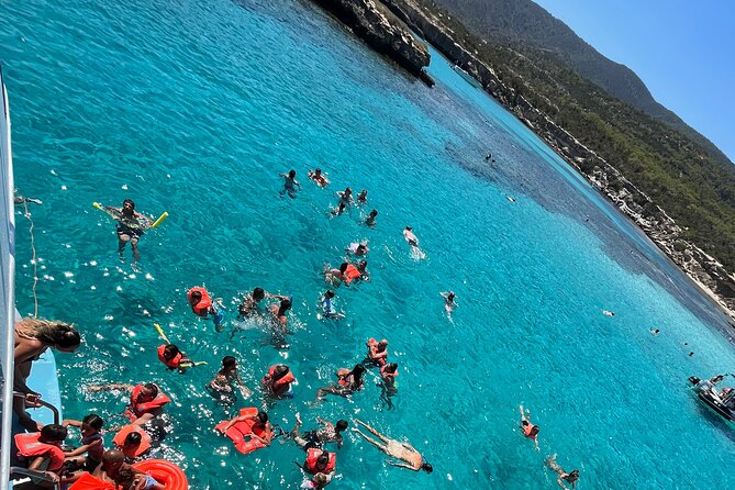 Blue Lagoon cruise: giant slide, music & Paphos hotel transfers - Onboard atmosphere: music, tables, and what happens when the boat gets busy