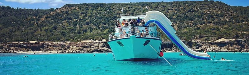 FROM LATCHI: Blue Lagoon Akamas Cruise - large water slide - Blue Lagoon Swim Time: Anchor Up, Climb Down, and Explore