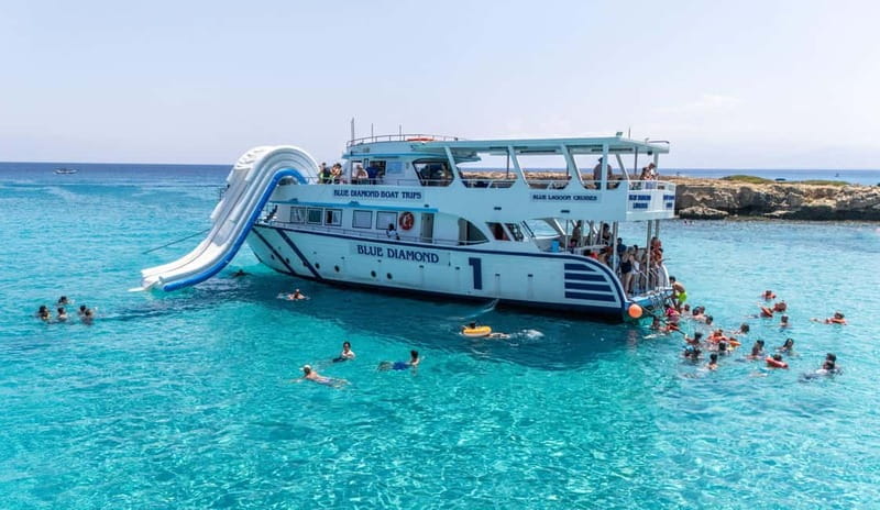 FROM LATCHI: Blue Lagoon Akamas Cruise - large water slide - Boarding the Blue Diamond at Latchi Harbour: Where You’ll Spend Your Time