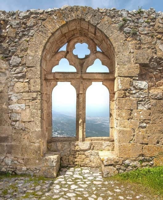 From North Cyprus: Kyrenia, St Hilarion Castle, Bellapais - Bellapais Abbey: the monastery terrace view and why it feels different