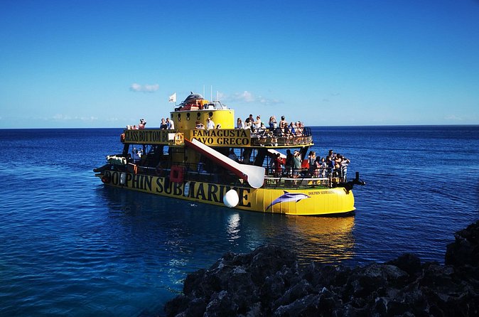 Glass Bottom Boat Dolphin Cruise to Blue Lagoon and Turtle Cove - Green Bay Beach: calm water, underwater life, and turtle odds