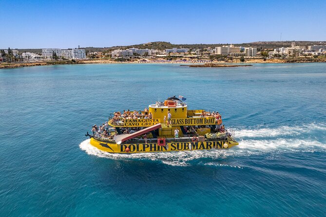 Glass Bottom Boat Dolphin Cruise to Blue Lagoon and Turtle Cove - Onboard setup: shaded seating, lower-deck AC, and kid-friendly fun