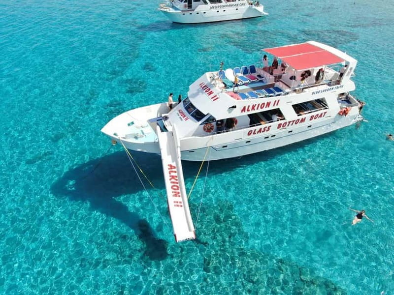 Latchi: Blue Lagoon Glass Bottom Boat Cruise with Drinks - Onboard bar, sunbeds, and included wine, fruit, and juice
