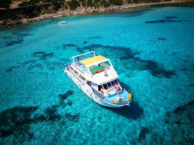 Paphos: Blue Lagoon Boat Adventure with Bus Transfer - Cruise time on deck: Akamas scenery, sea caves, and photo stops