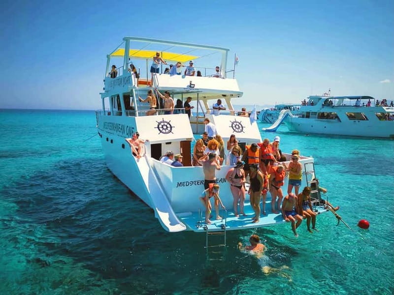 Paphos: Blue Lagoon Boat Adventure with Bus Transfer - Captain’s complimentary wine, fruit, and juice: the included treat that matters