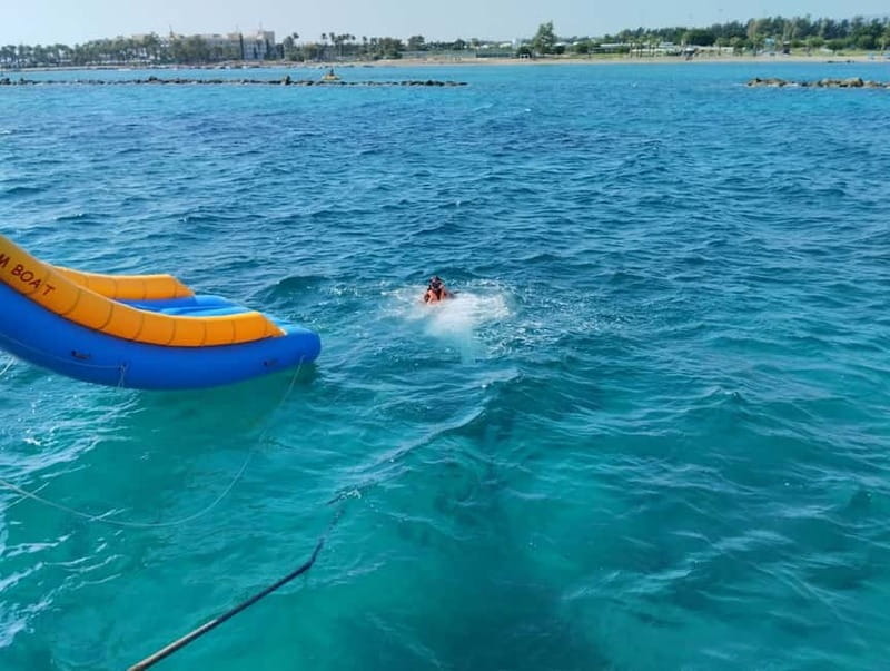 Paphos: Glass Bottom Boat Trip with Swimming or Snorkeling - The slide and jumping platform on the bigger adventures