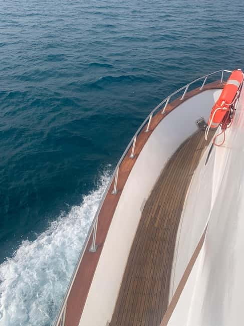 Protaras: 80s and 90s Sunset Cruise with Cypriot Dinner & DJ - Turtle Bay and the chance to swim with turtles