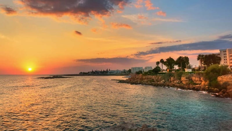 Protaras: Blue Lagoon, Sea Caves and Turtle Cove Sunset Trip - Getting to the pier: the yellow umbrella and the Dolphin Submarine boat