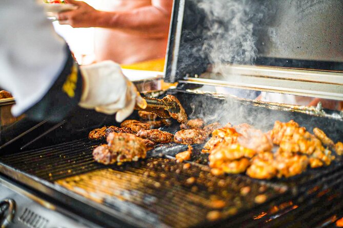 Wave Dancer Half Day BBQ Cruise - All Inclusive - Coral Bay swim stop: clear shallow water, Blue Flag beach vibes
