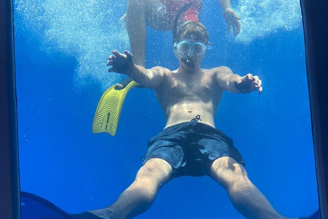 Yellow Submarine Swimming Cruise with Unlimited Drinks - Stop 1 Bonus Moment: Fish Feeding and Below Deck Viewing